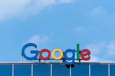 Google logo displayed on the rooftop of a building.